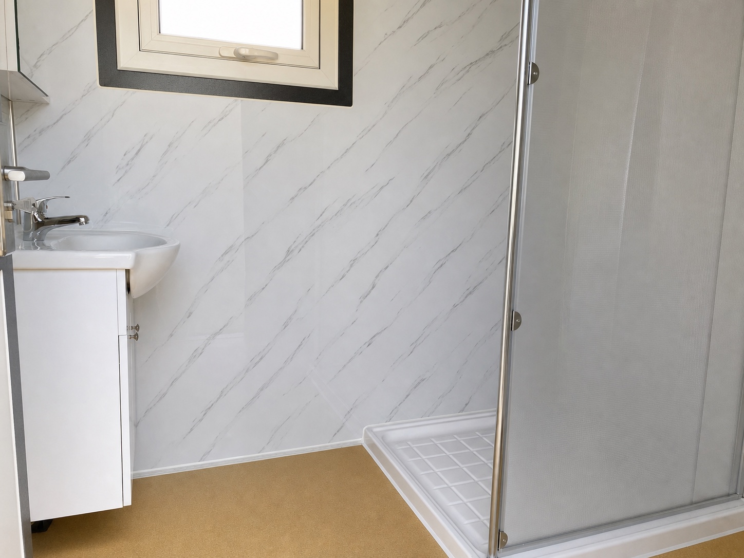 Clean interior overview of the Versyhire ensuite